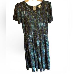 LuLaRoe Amelia dress featuring a peacock feathers pattern